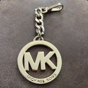 Michael Kors gold purse charm